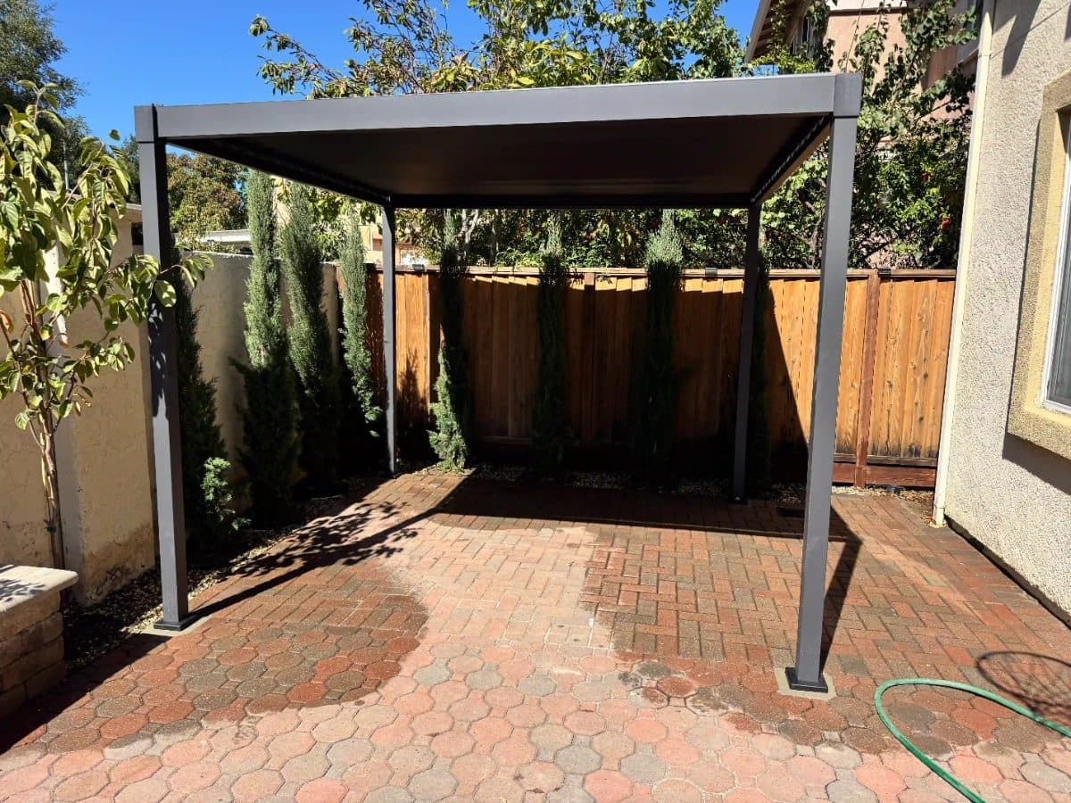 Anchoring a Mirador Pergola to a Brick Patio